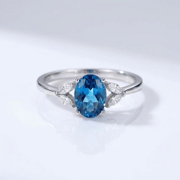 SILVER BLUE TOPAZ OVAL RING - (ADJUSTABLE)